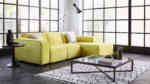 Yellow velvet modular sofa with a chaise and corner unit and separate units that keeps together with clips so it does not slide apart