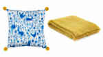 Bright blue cushion and yellow throw